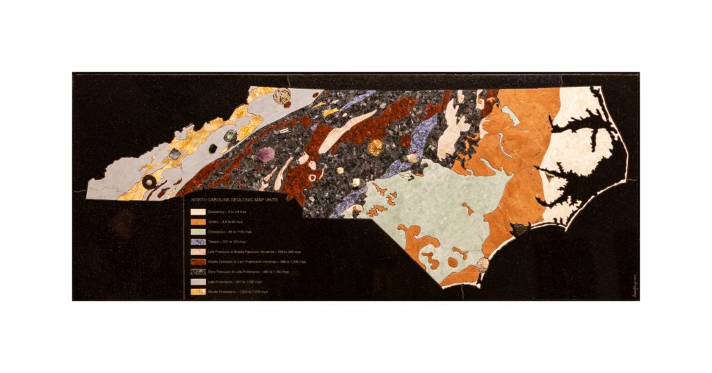 A geologic map of the state of north Carolina created with different colored stones