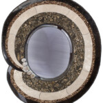 Fossil Mirror <br>
31" x 35", 2005 <br>
Gastropod limestone, travertine, jasper, marble, selenite roses, custom tile, custom beveled mirror A mirror with a black and white design on it.