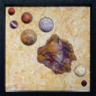 Earth Sampler IV: Arizona Petrified Wood <br>
13" x 13", 2014 <br>
Marble, spheres of red jasper, malachite, petrified wood, coquina, lepidolite, mookite, red jasper; petrified wood A painting of planets and rocks on the ground.