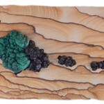 Pocket III: When Malachite Met Psilomelane <br>
22.5" x 10.13", 2016 <br>
Kanab sandstone, botryoidal malachite and psilomelane A wooden board with some green and black stuff on it