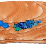 Pocket V: Azure Oasis <br>
23" x 9", 2016 <br>
Kanab sandstone, azurite concretions, azurite/malachite concretions, azurite "blueberries" A painting of blue flowers on wood