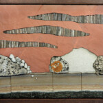 Utah Rustic <br>
26" x 17.5", 2016 <br>
Red sandstone, garnet schist, white sandstone, calcite sheets, moqui marbles, sandstone concretions A painting of rocks and clouds on the side of a wall.