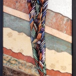 A colorful tie hanging on the wall