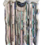 Waves IX: Physalia<br>
8 5/8” x 17”, 2018<br>
Quartz crystals, amethyst, marble, fuchsitic chert, amazonite, rhodonite, ruby in fuchsite, piedmontite, slate, opalized fluorite, lepidolite, aventurine, gabbro <br>
Spheres of: jasper <br>
Stone discs of: rose quartz, aventurine A large piece of art made from wood and yarn.