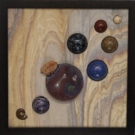 Earth Sampler Series VIII: Sandstone & Agate <br> 13" x 13", 2019 <br> Sandstone; banded agate, spheres of jasper, cocquina, gabbro, lapis, amethyst; creedite crystal, fossil ammonite A wooden table with some buttons on it