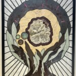 Cosmic Flower <br>
28.5” x 23.25” 2024 <br>
Quartz geode, stalagtitic amethyst, cobaltoan calcite crystals; slabs of marble, slate, ruby in kyanite; dumortierite; spheres of fuchsite with ruby, jade, agate A stained glass window depicting the tree of life.