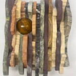 Waves XX: Contract and Expand
<br>
8.75” x 6.5”x 2”, 2023 A close up of a sculpture made out of wood