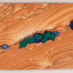 Pocket 10: Life Spring<br>
17.25” x 10”, 2018 <br>
Kanab sandstone, azurite “blueberries,” azurite & malachite crystal clusters, azurite concretions A painting of a green and blue area on wood.