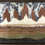 Shangri La <br>
19" x 27 1/2", 2020 <br>
Slabs: lepidolite, pegmatite, sandstone, travertine, banded dolomite, lime, epidote with garnet, slate <br>$5000 A picture of some food that is on the table.