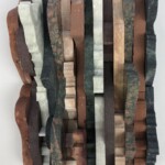 Waves X: In the Shadows <br> 10" x 5 3/4" x 3 1/2", 2019 <br> Travertine, marble, matesomatite, sandstone, jasper A piece of wood with many different colors