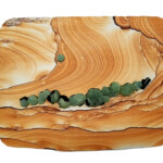 Pocket IX: Illuminated Canyon<br>
17.5” x 13.5”, 2018 <br>
Kanab sandstone; prehnite and epidote crystals A picture of the side of a tree.