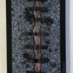 Lockdown <br> 12.25” x 7.75” x 2.25”, 2022 <br> Gabbro, sodalite syenite, spiderweb rhodonite, mariposite A black and white picture of a train track
