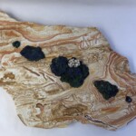 Pocket 20: Reflection of Clouds <br> 25.5” x 35.5” x 3.75”, 2022 <br> Rhyolitic tuff; malachite and azurite crystals, botryoidal calcite, azurite crystal A piece of wood with rocks on it